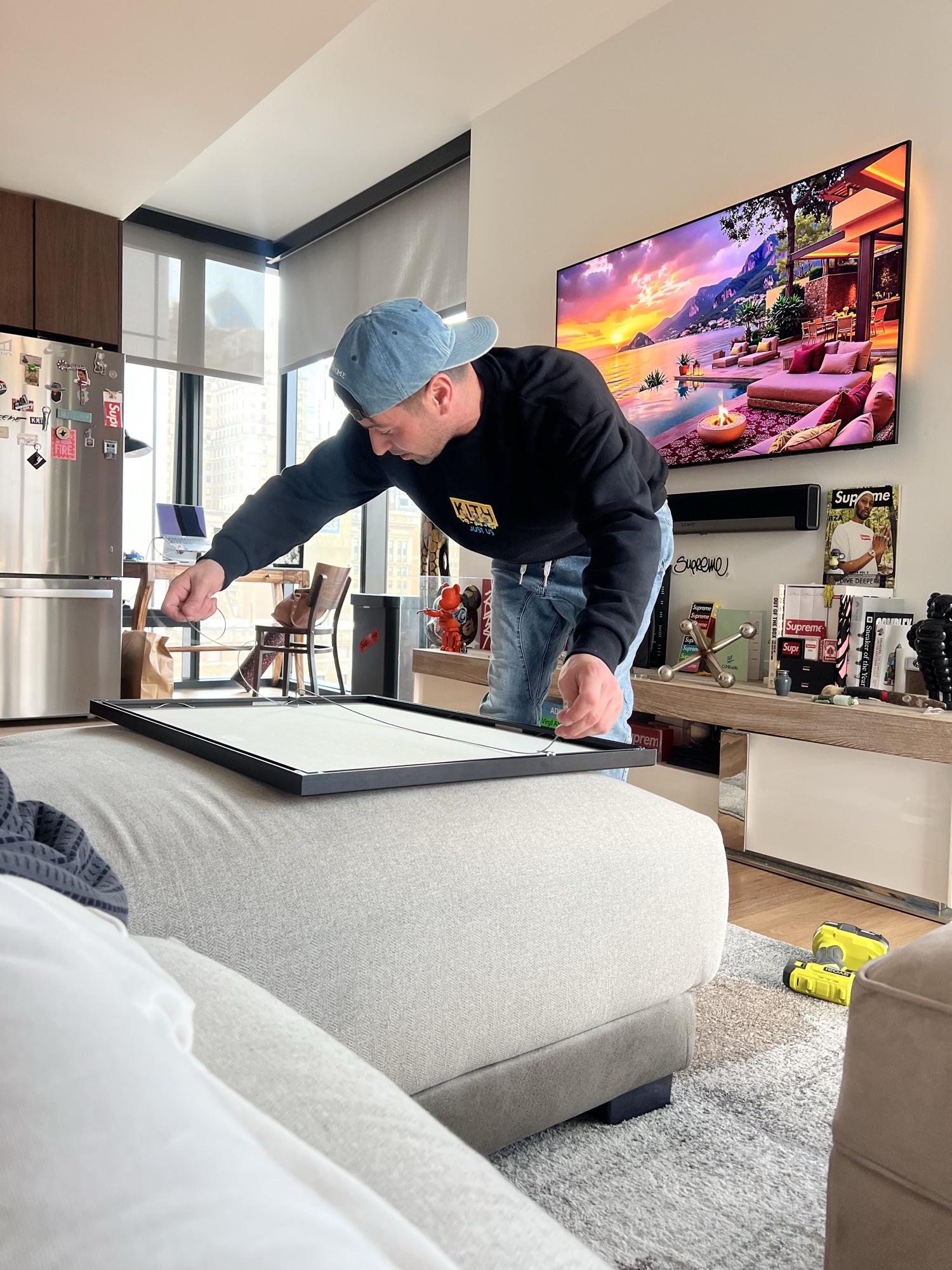 Anthony of Never Miss Out assembling and framing a custom collector display